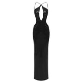 Robe longue à paillettes dos nu et découpes pour boîte de nuit